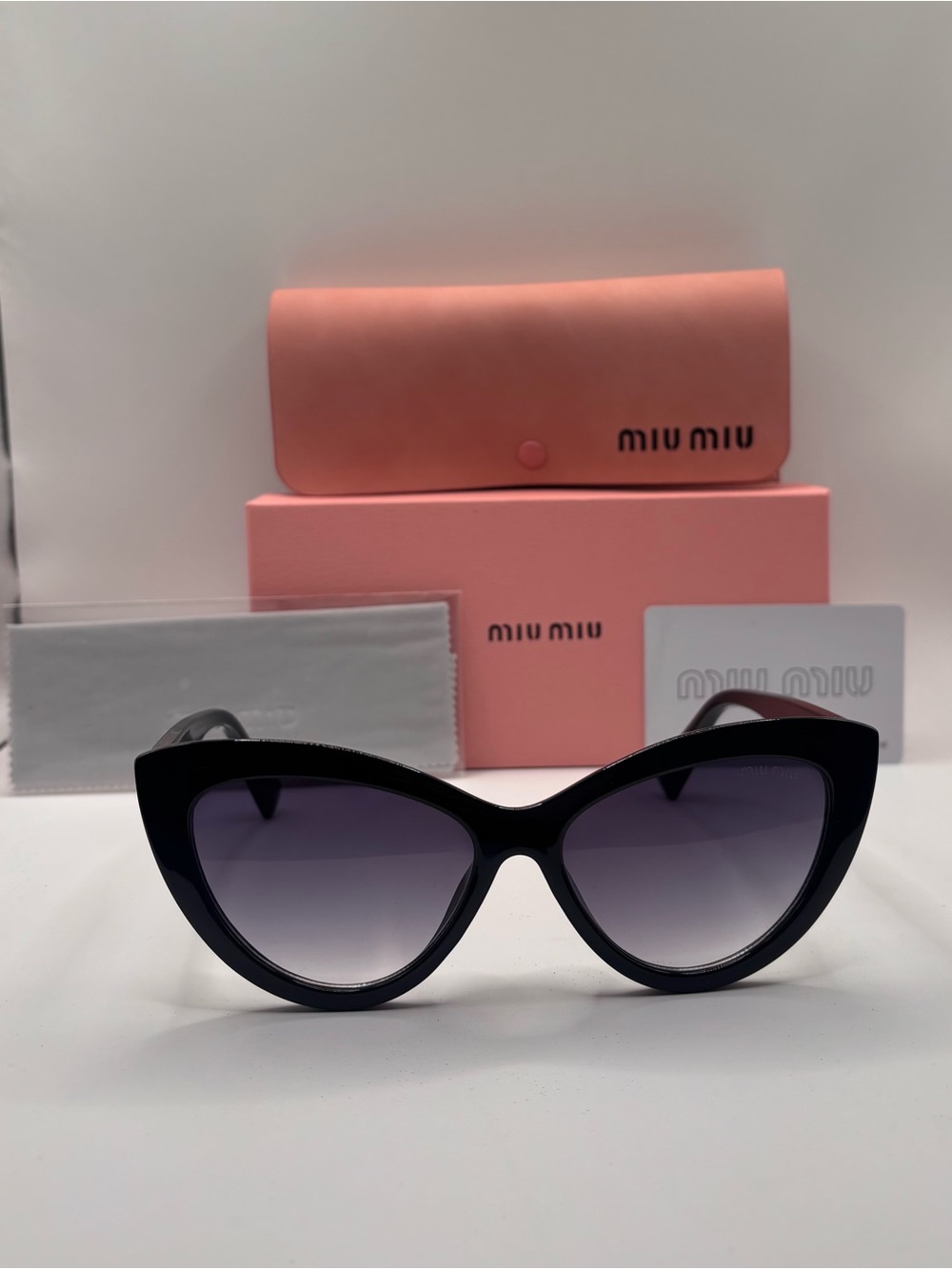 Miu Miu Black Cat-Eye Sunglasses with Gradient Lenses